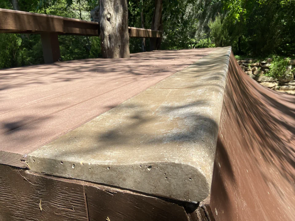 Pool coping dry fit along the deck edge before installing.