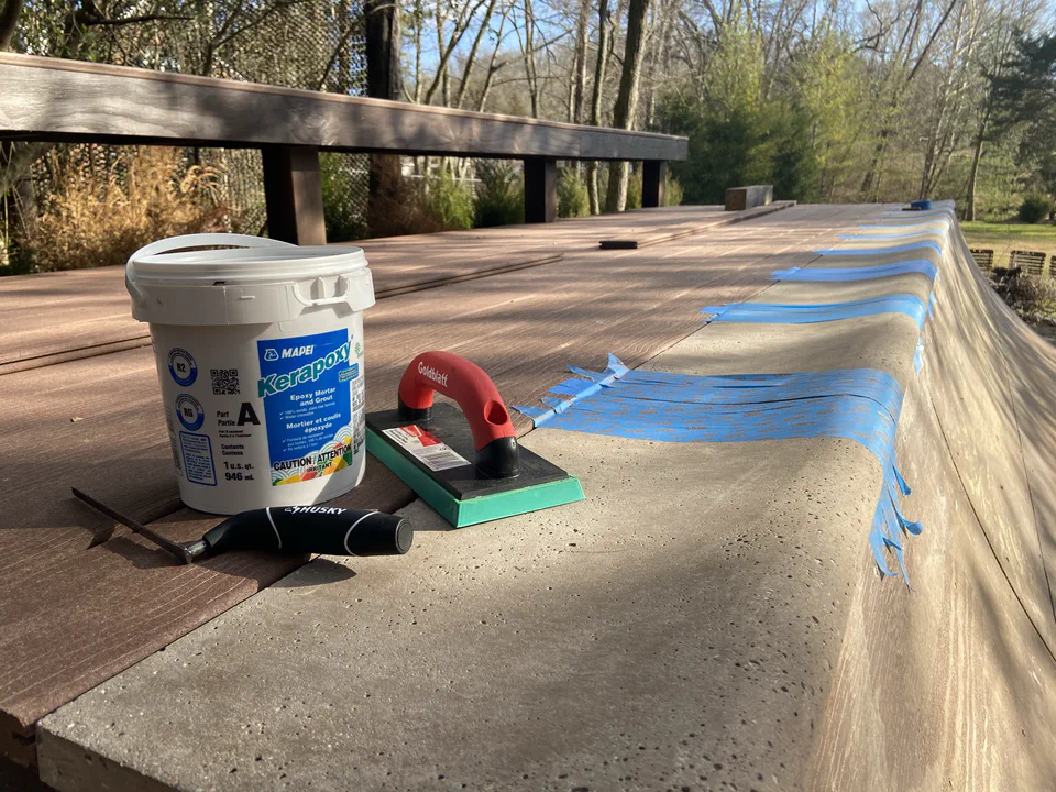 Taped off coping for epoxy grout between tiles.
