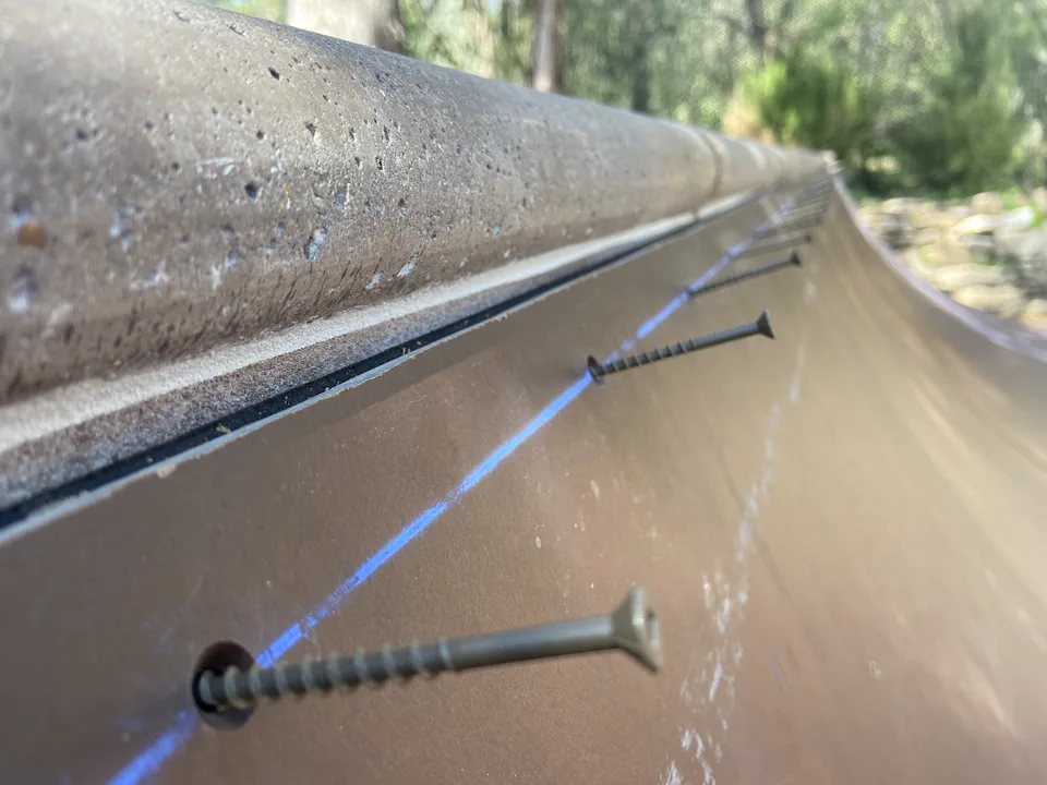 Final Ramp Armor surface screws set and countersunk along the transition, coping above.