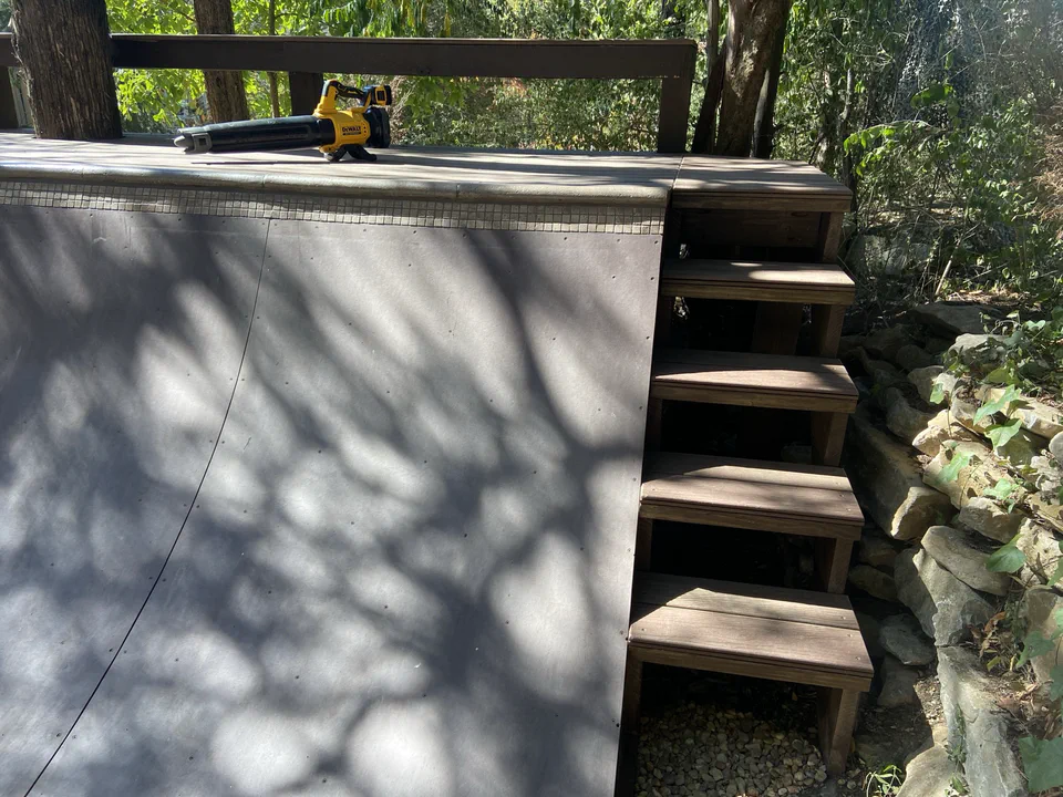 New stairs along the stone wall — another rebuild addition.