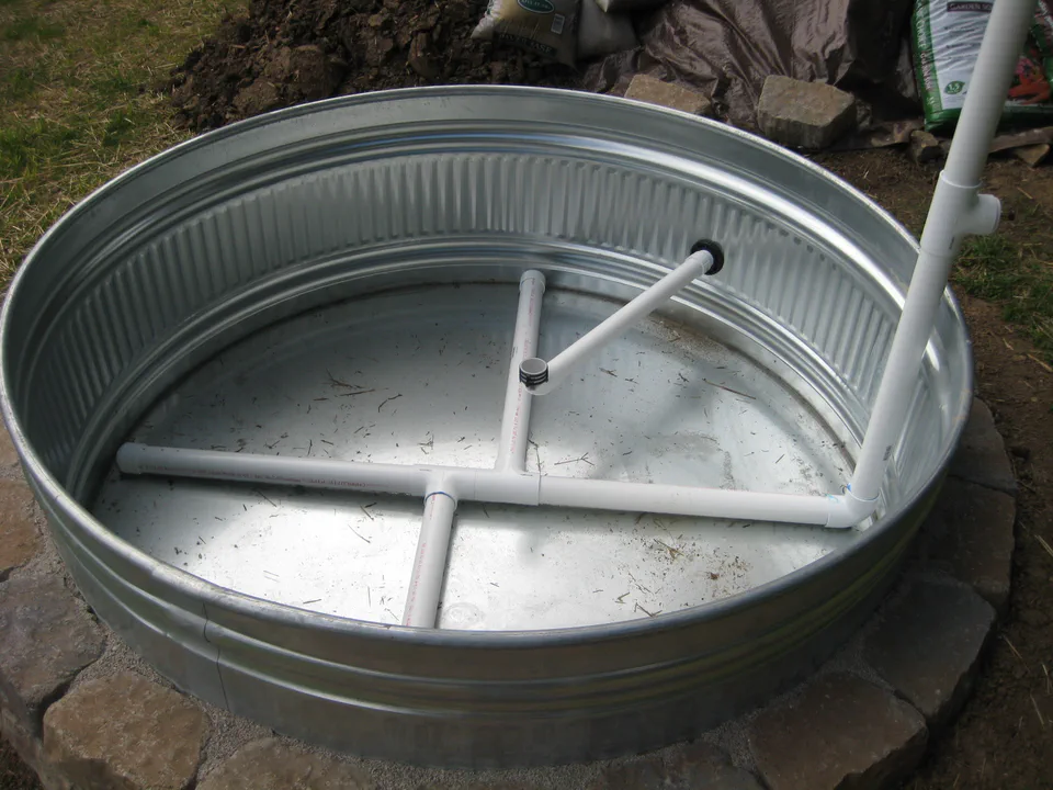 The manifold from another angle, fill riser standing out of the tank.